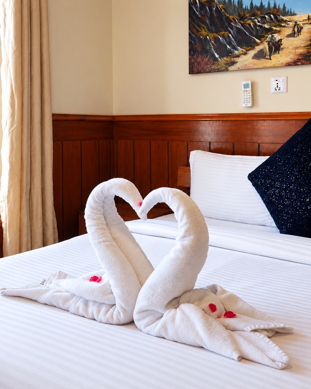 Towel swans on the bed
