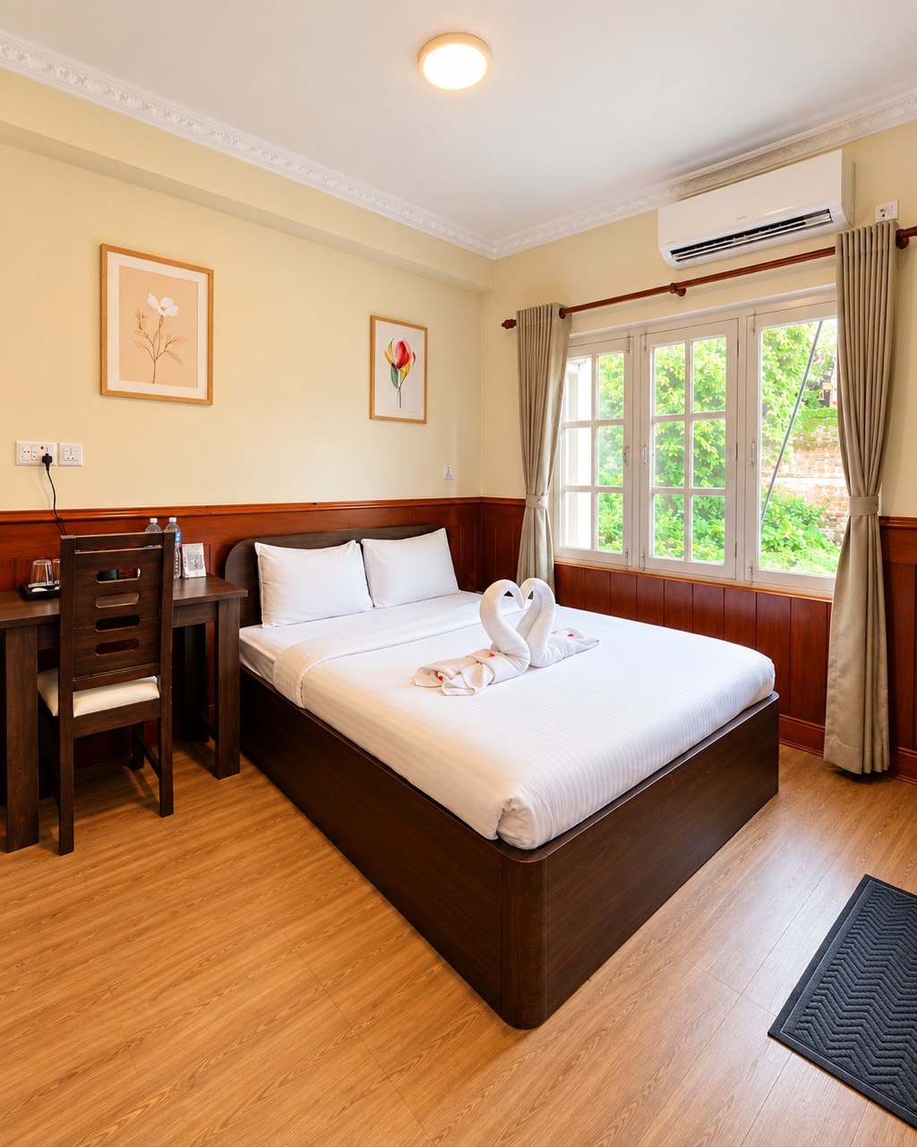 Suite with a bed, desk and garden window